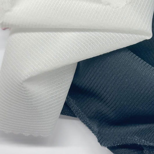 Fabrisoul woven fusible interlining designed to provide stable shaping, smooth bonding, and long‑lasting garment structure.